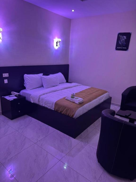 Postel nebo postele na pokoji v ubytování Golden Hits Hotel and Suites