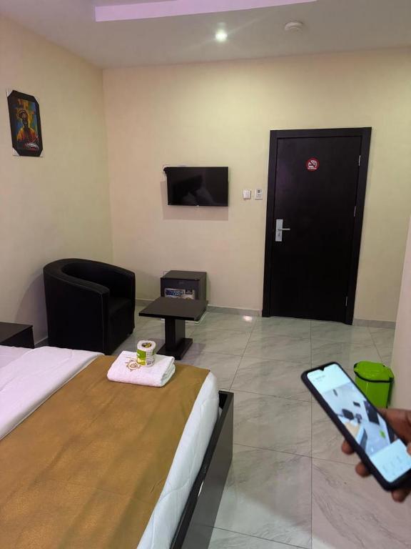 TV a/nebo společenská místnost v ubytování Golden Hits Hotel and Suites