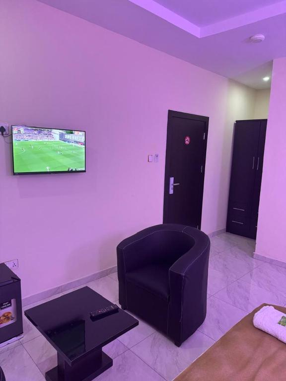 TV a/nebo společenská místnost v ubytování Golden Hits Hotel and Suites