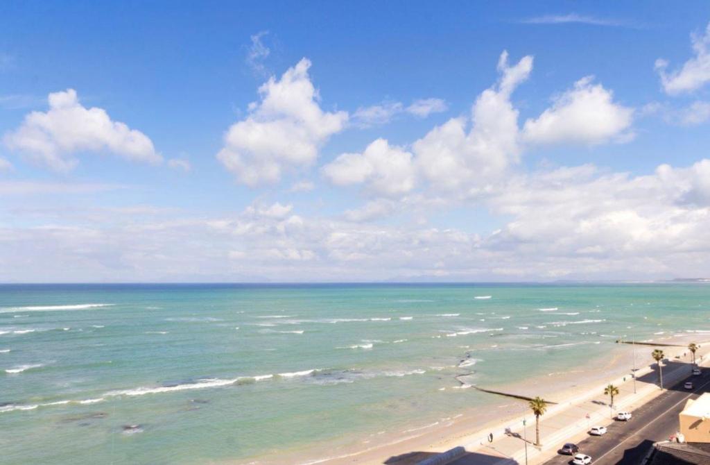 a view of a beach with the ocean at Penthouse Strand in Strand