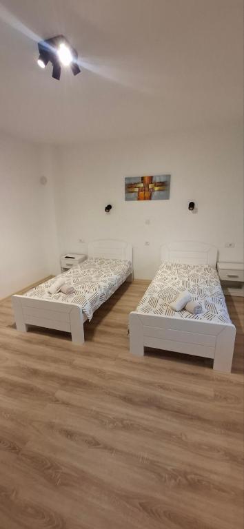 Postel nebo postele na pokoji v ubytování Apartman Marija