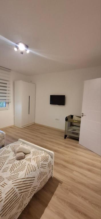 Postel nebo postele na pokoji v ubytování Apartman Marija