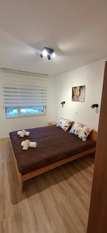 Postel nebo postele na pokoji v ubytování Apartman Marija