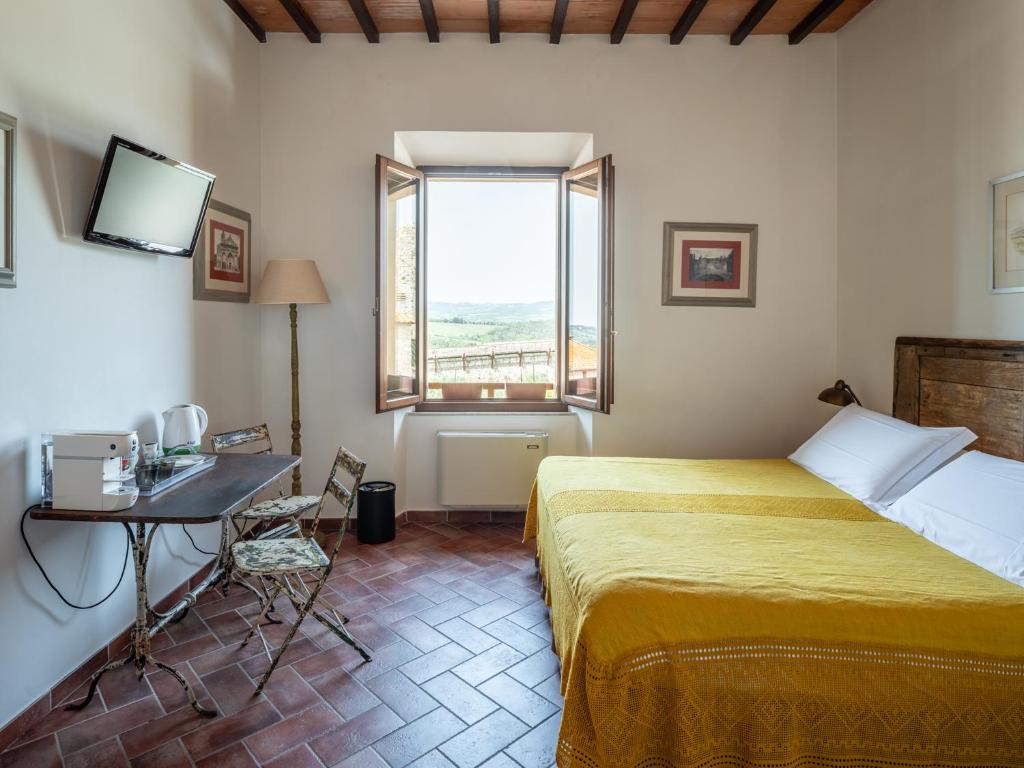 Posteľ alebo postele v izbe v ubytovaní Rooms and Wine al Castello