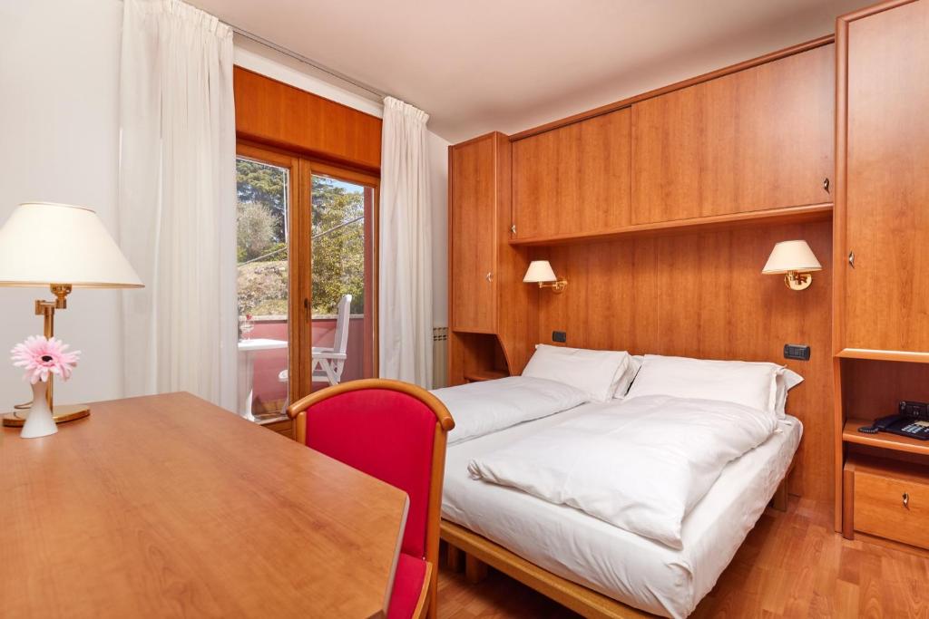 Postel nebo postele na pokoji v ubytování Beach Hotel Rosa