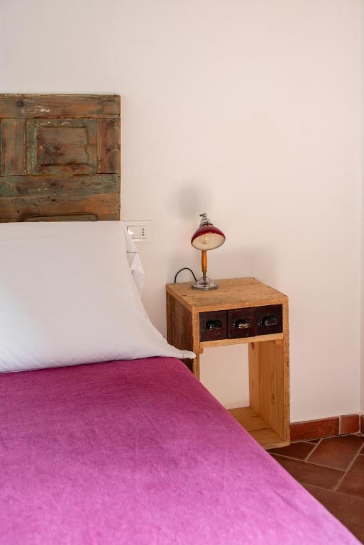 Posteľ alebo postele v izbe v ubytovaní Rooms and Wine al Castello