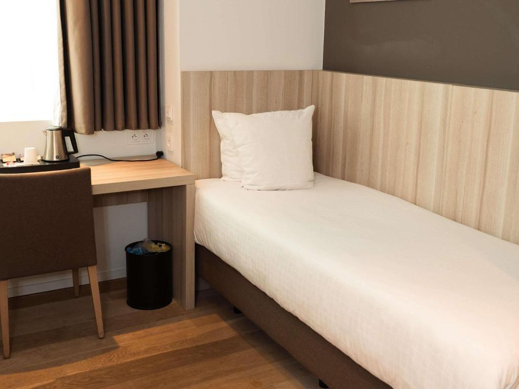 Postel nebo postele na pokoji v ubytování Mercure Roeselare