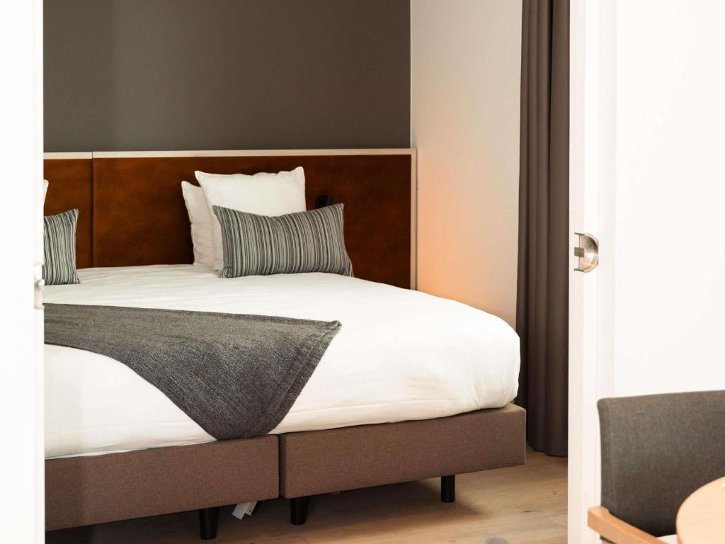Postel nebo postele na pokoji v ubytování Mercure Roeselare