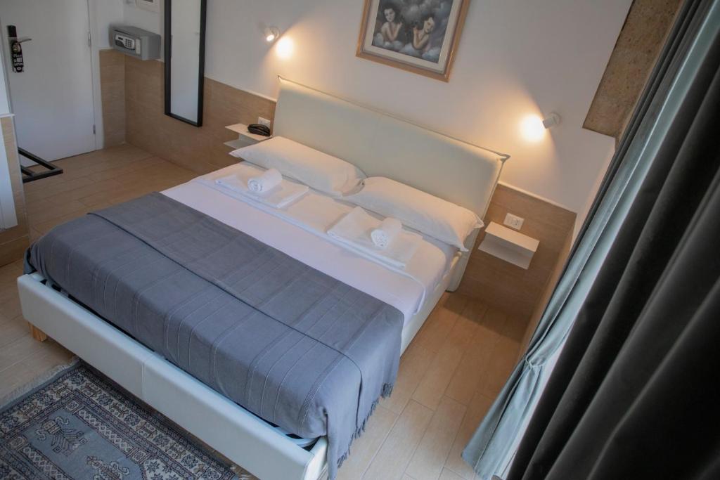 Postel nebo postele na pokoji v ubytování H22 Hotel