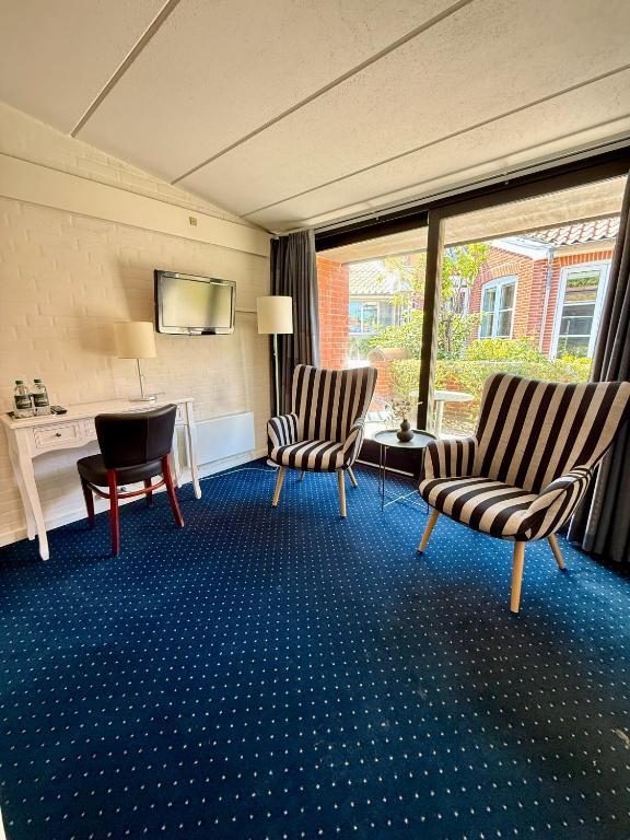 TV a/nebo společenská místnost v ubytování Hotel Birksø