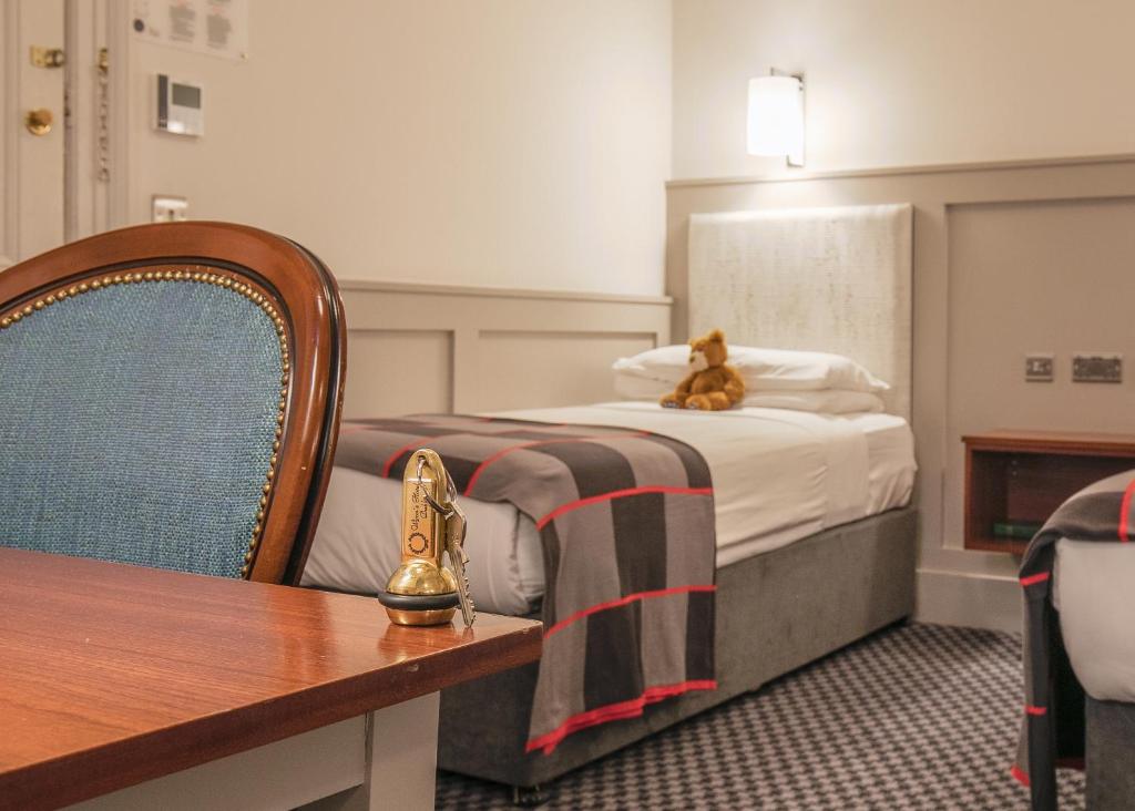 Postel nebo postele na pokoji v ubytování Wynn's Hotel