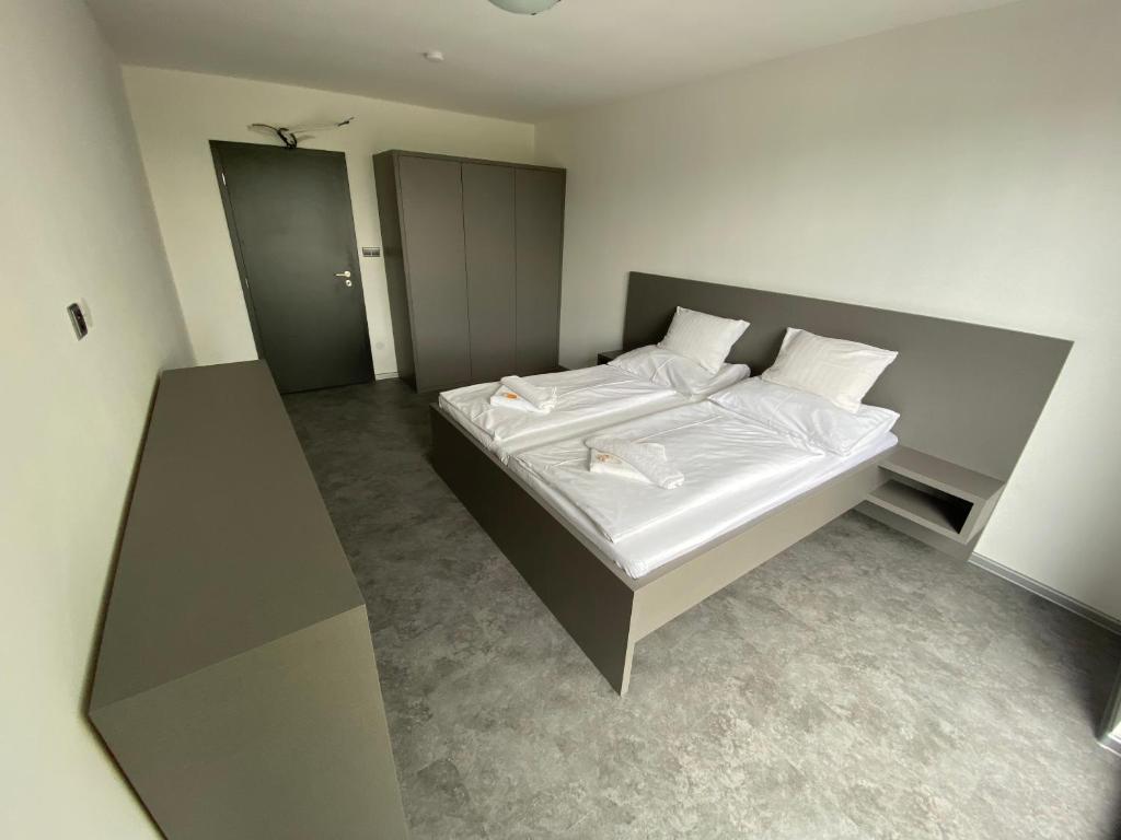Postel nebo postele na pokoji v ubytování Hotel Rakovec