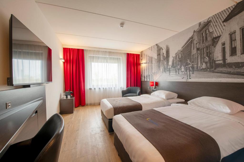 Postelja oz. postelje v sobi nastanitve Bastion Hotel Zoetermeer
