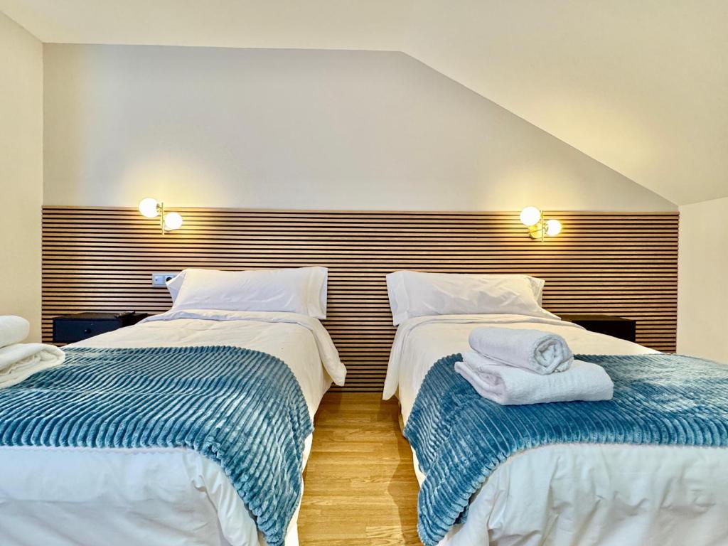 Postel nebo postele na pokoji v ubytování Hotel Ávila Diró