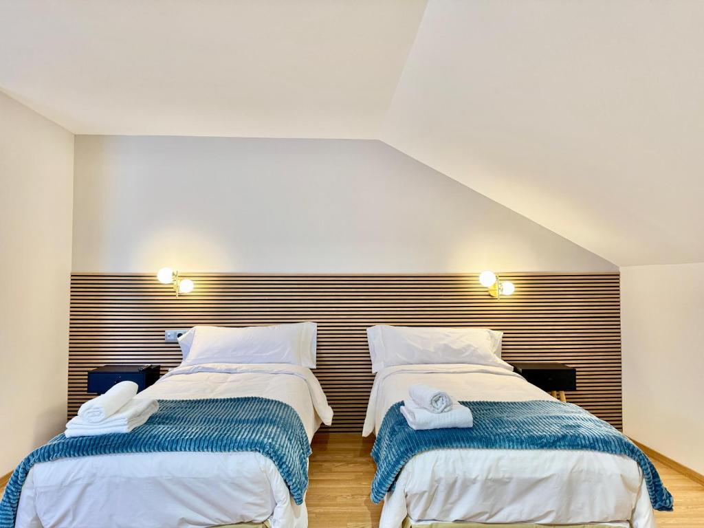 Postel nebo postele na pokoji v ubytování Hotel Ávila Diró