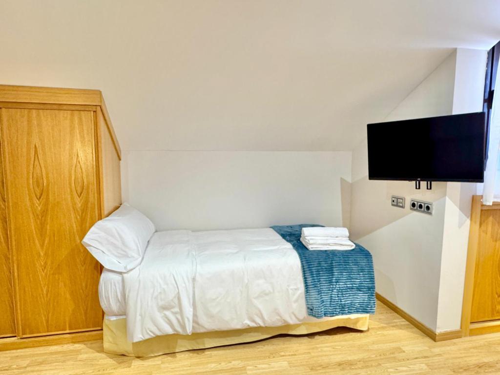 Postel nebo postele na pokoji v ubytování Hotel Ávila Diró