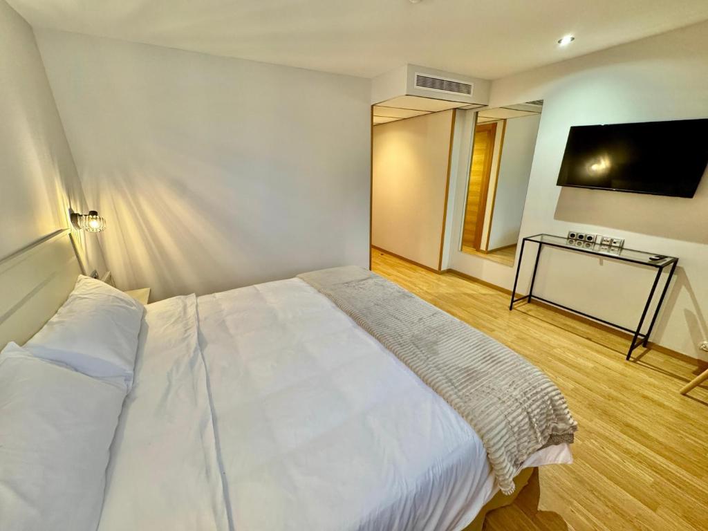 Postel nebo postele na pokoji v ubytování Hotel Ávila Diró