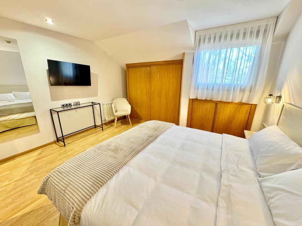 Postel nebo postele na pokoji v ubytování Hotel Ávila Diró