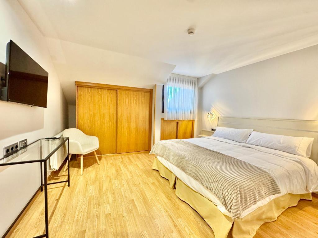 Postel nebo postele na pokoji v ubytování Hotel Ávila Diró