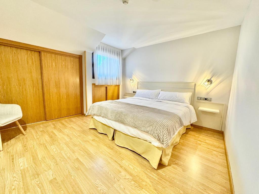 Postel nebo postele na pokoji v ubytování Hotel Ávila Diró