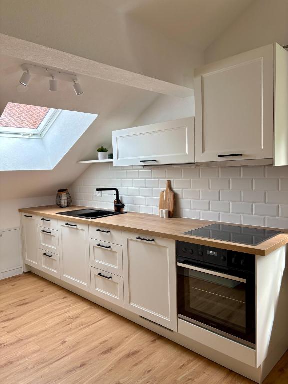 Kuchyň nebo kuchyňský kout v ubytování ALLGÄUHERZ - Ferienwohnung zentral in Nesselwang