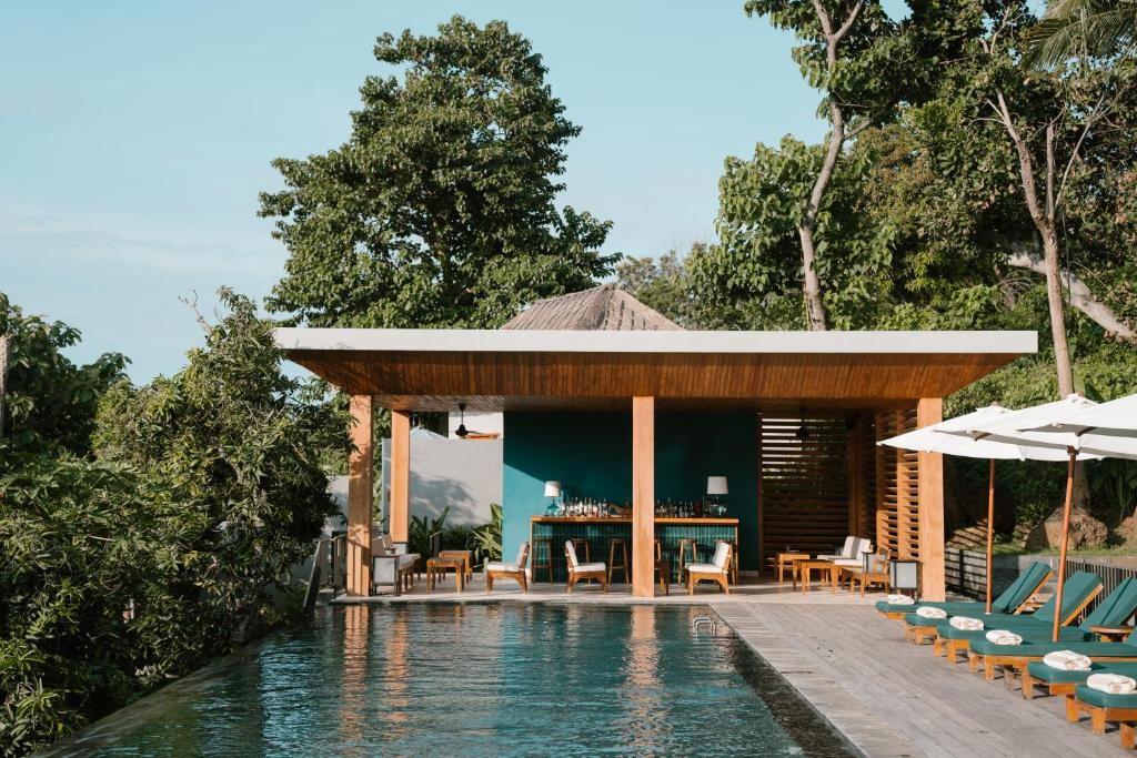 Bazén v ubytování Sanglung Villas & Suites nebo v jeho okolí