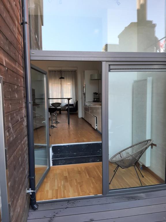 a view of a living room from a sliding glass door at apartment Amsterdamstr 1st fl in Ostend
