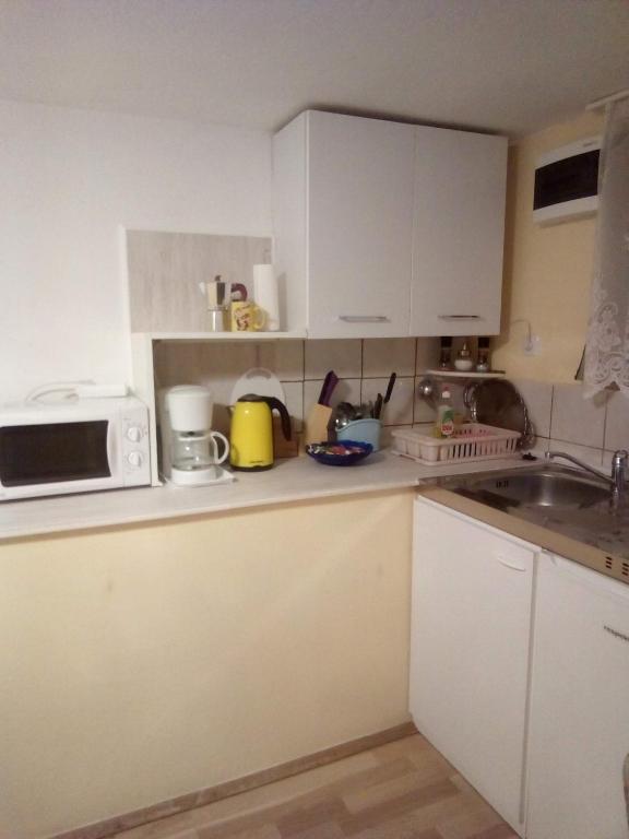Kuchyň nebo kuchyňský kout v ubytování Apartman Tihana