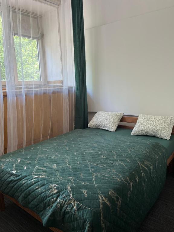 Postel nebo postele na pokoji v ubytování Tom Hostel