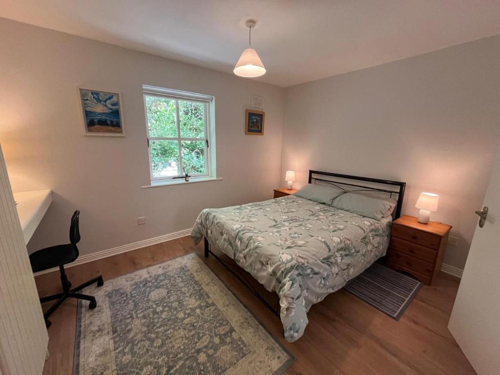 a bedroom with a bed and a window at 112 Clifden Glen in Clifden