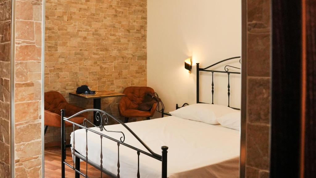 Posteľ alebo postele v izbe v ubytovaní Uria Rooms & Suite B&B