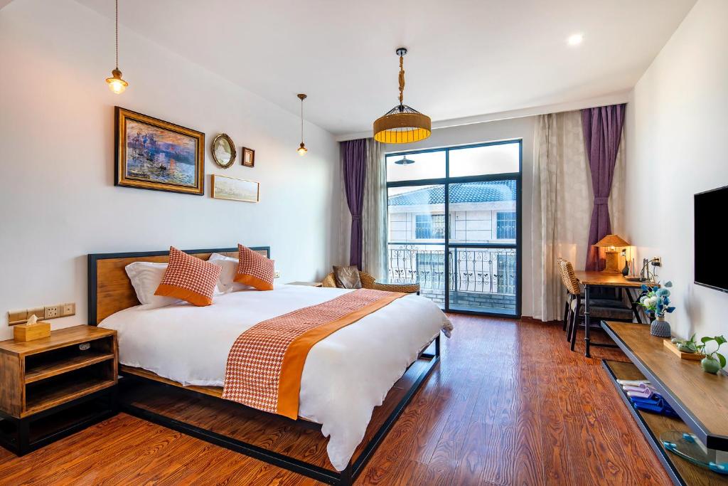 Postel nebo postele na pokoji v ubytování Shanghai nanfeng hotel-上海楠枫花园酒店