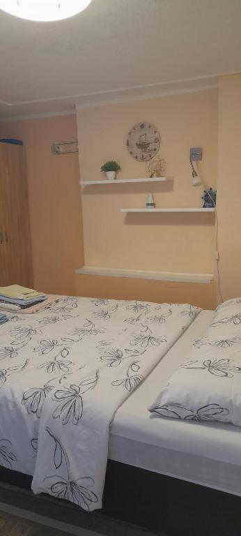 Postel nebo postele na pokoji v ubytování Apartman Tihana