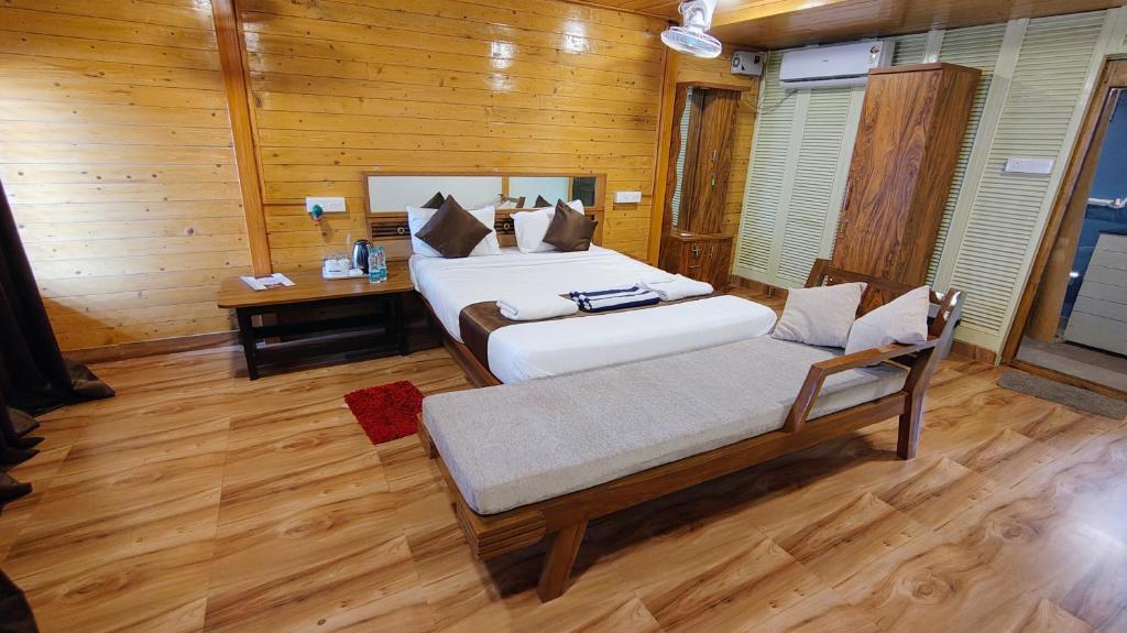 Postel nebo postele na pokoji v ubytování Darsy Residency