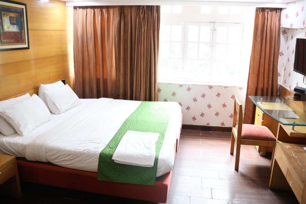 Postel nebo postele na pokoji v ubytování Hotels Daffodils