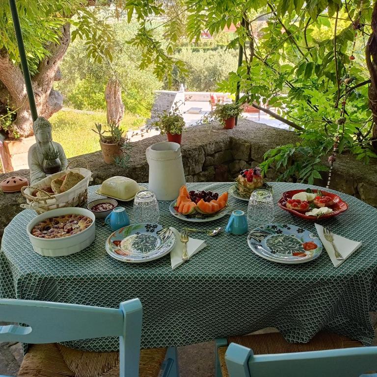 a table with plates of food on it at le finestre sul mare in Conversano