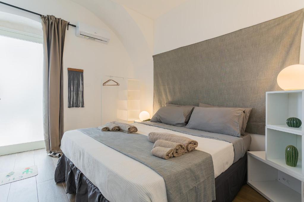 Postel nebo postele na pokoji v ubytování B&Vibes Monopoli