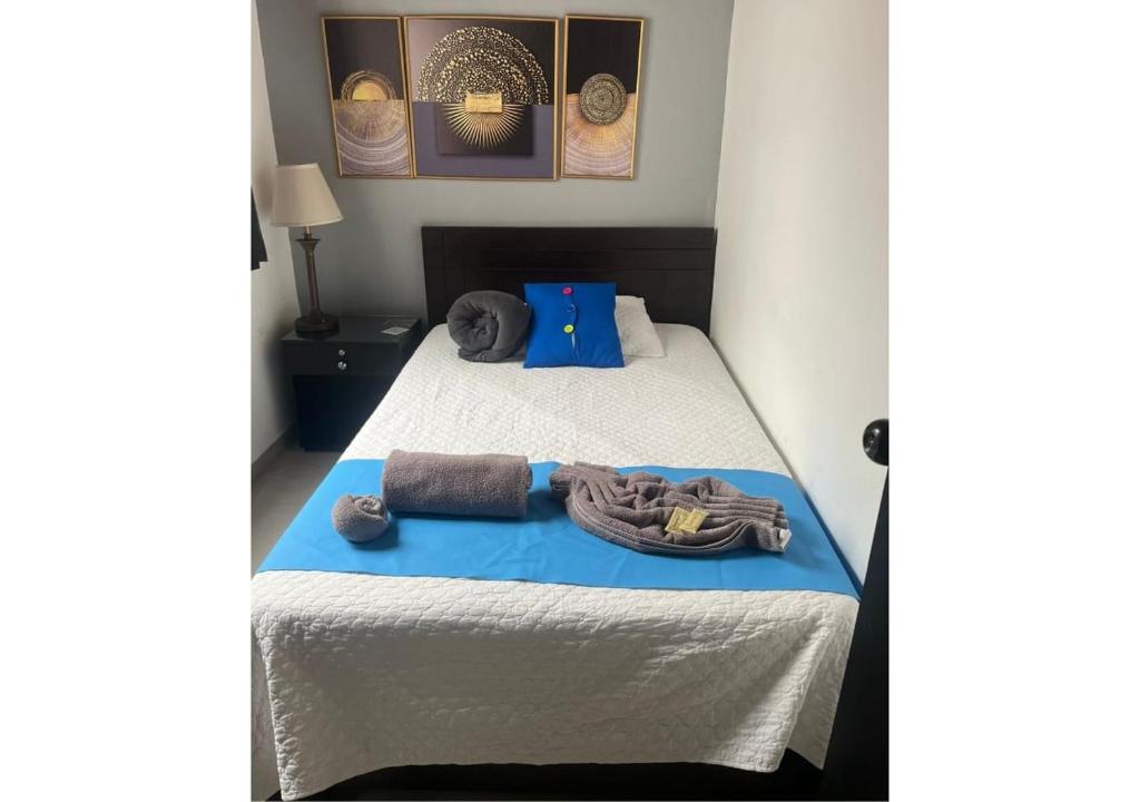 Postel nebo postele na pokoji v ubytování International Hotel Medellín