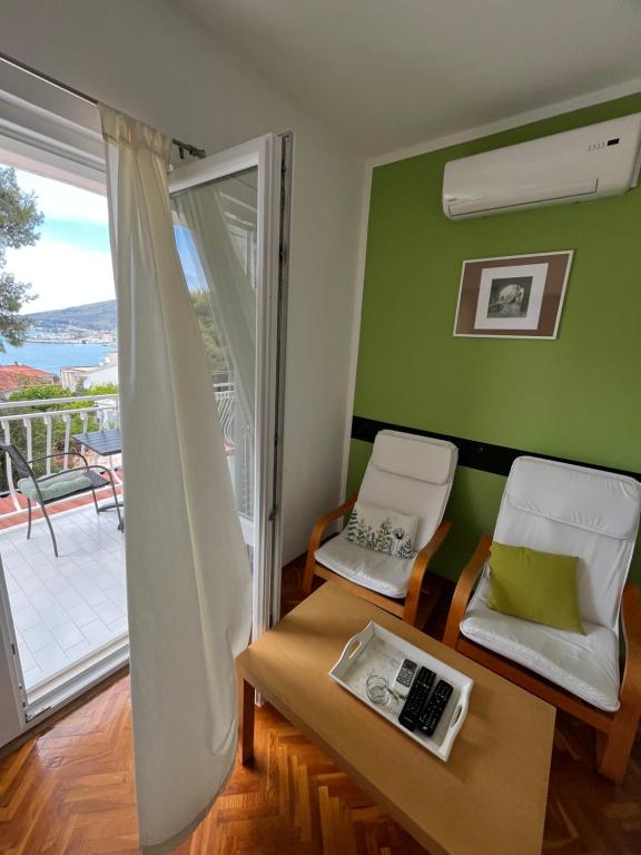 Una cama o camas en una habitación de Apartmani Ivan