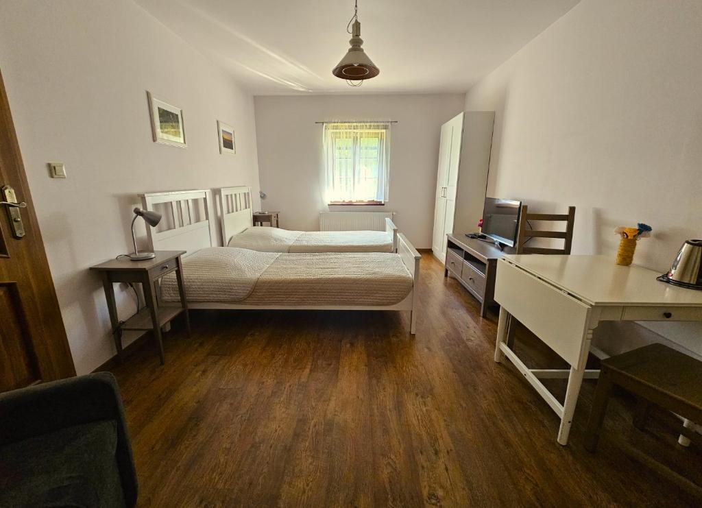 Postel nebo postele na pokoji v ubytování Gospodarstwo nad jeziorem