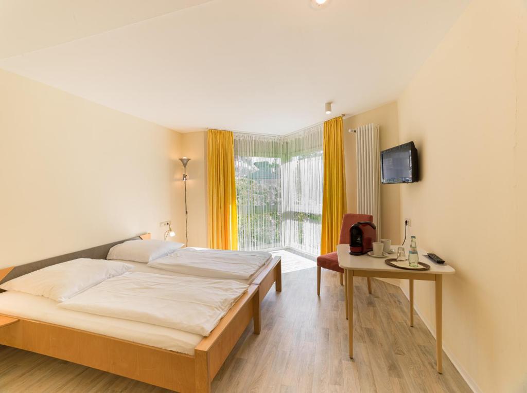 Postel nebo postele na pokoji v ubytování Park Hotel