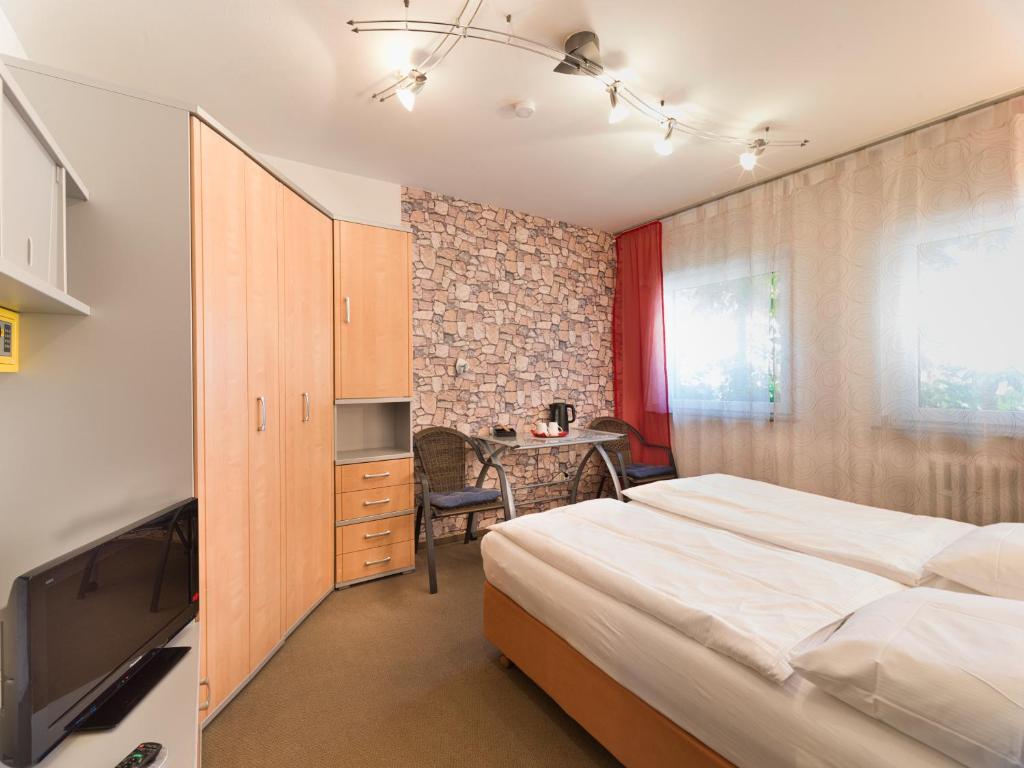 Postel nebo postele na pokoji v ubytování Park Hotel