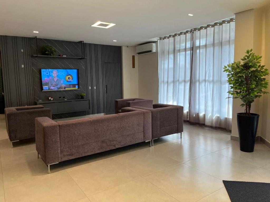 TV a/nebo společenská místnost v ubytování Moura Palace Hotel