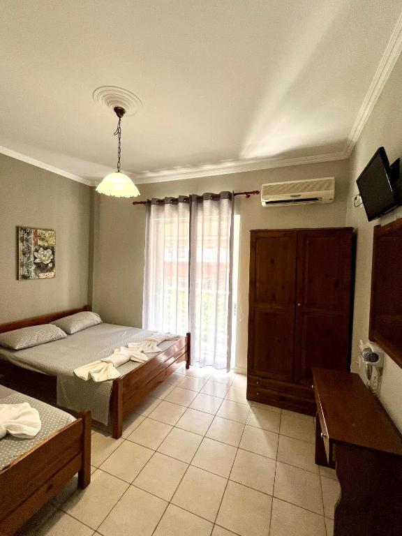 Postel nebo postele na pokoji v ubytování Nopi Rooms