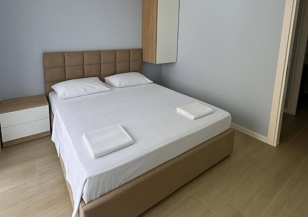 Postel nebo postele na pokoji v ubytování AMMEN Apartment