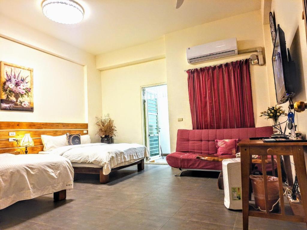 Postel nebo postele na pokoji v ubytování Ruisui Style B&B