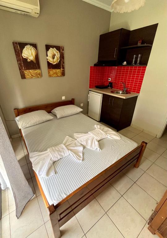 Postel nebo postele na pokoji v ubytování Nopi Rooms