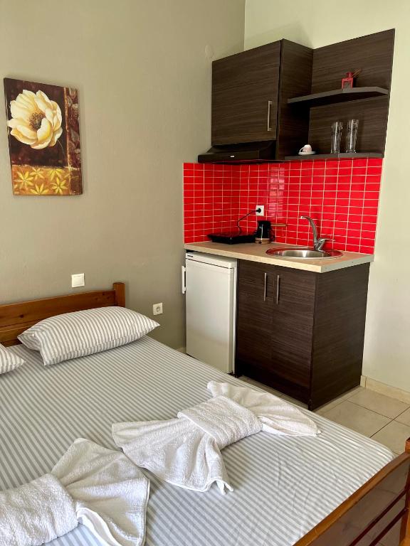 Postel nebo postele na pokoji v ubytování Nopi Rooms