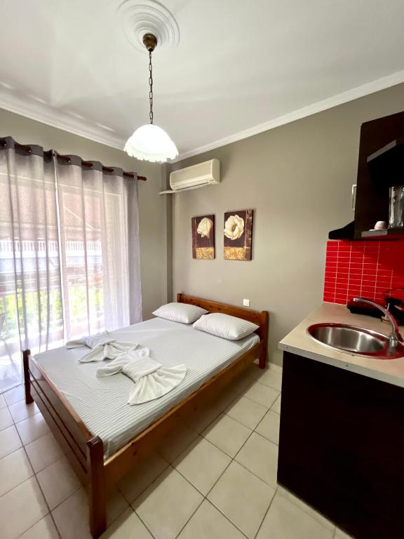 Postel nebo postele na pokoji v ubytování Nopi Rooms