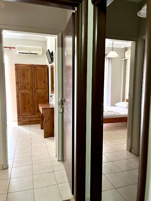 Postel nebo postele na pokoji v ubytování Nopi Rooms